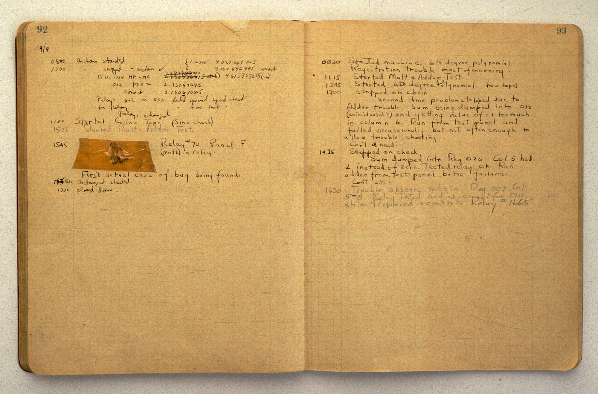 Image of computer log book with moth taped inside